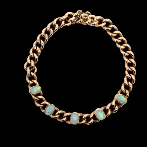 26 - An opal bracelet stamped 15ct. Weight 15.02g.