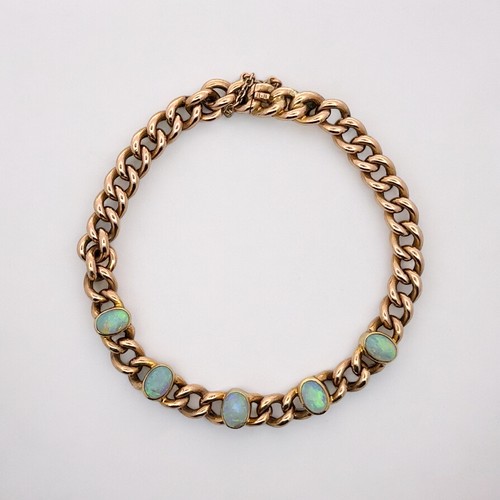 26 - An opal bracelet stamped 15ct. Weight 15.02g.