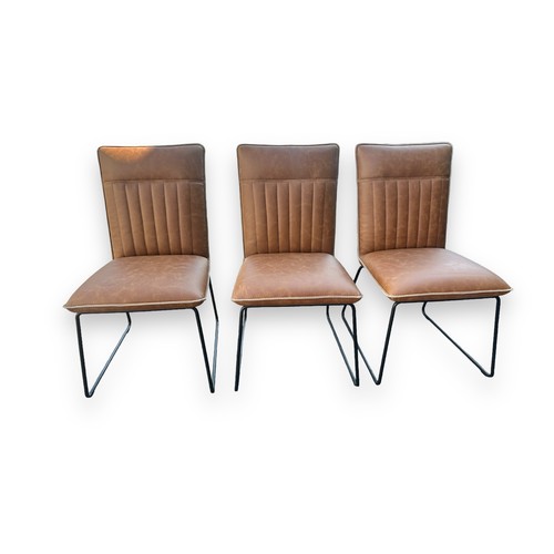 473 - Cleo Faux Leather industrial dining chairs set of three in tan. Stitched backs, matte metal legs, so... 