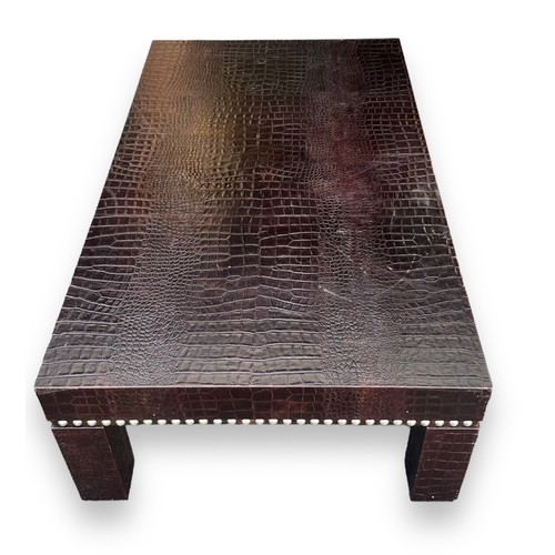 476 - Large contemporary faux crocodile skin coffee table with studded surround design. Height 40cm, lengt... 