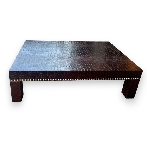 476 - Large contemporary faux crocodile skin coffee table with studded surround design. Height 40cm, lengt... 