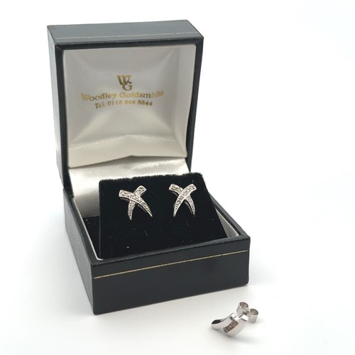 24A - A pair of white gold earrings and diamond earrings stamped 375, and a single 9ct white gold and CZ e... 