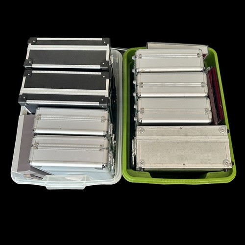 376 - Eleven empty coin cases. Includes 8 metal coin cases (some with keys), a wooden case and 2 plastic c... 