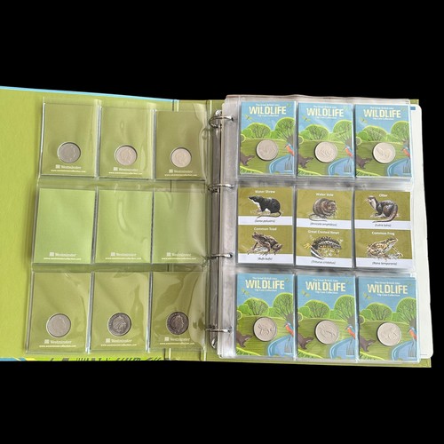 365 - Guernsey 2022 Wildlife 10p coins on card (48), plus 50p shaped bird medallions (10), in a Westminste... 