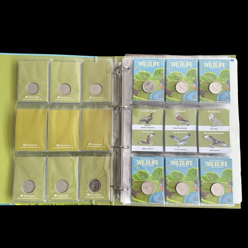 365 - Guernsey 2022 Wildlife 10p coins on card (48), plus 50p shaped bird medallions (10), in a Westminste... 