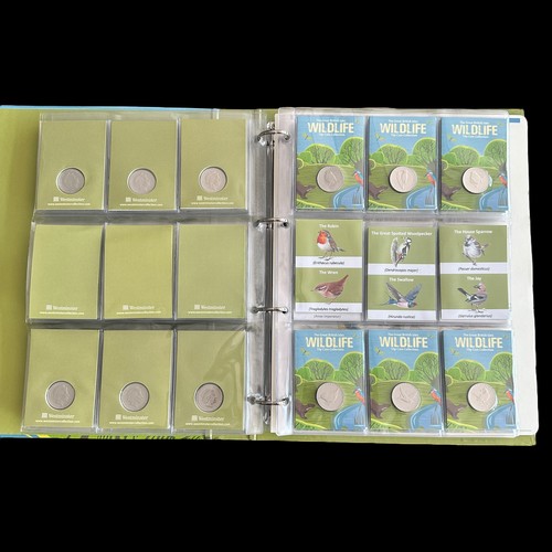 365 - Guernsey 2022 Wildlife 10p coins on card (48), plus 50p shaped bird medallions (10), in a Westminste... 