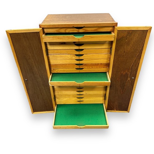 55 - Wooden standing medal display / storage cabinet with 20 pull out drawers and two folding doors. Heig... 