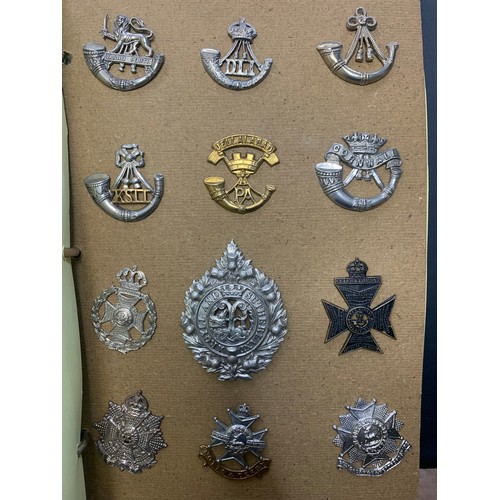 57 - Cap badges, large mixed collection in organised album and loose with many examples of better. Includ... 