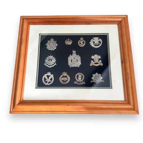 58A - Cap badges in two frames and loose, 31 badges in total with 27 in frames. Includes Royal Warwickshir... 