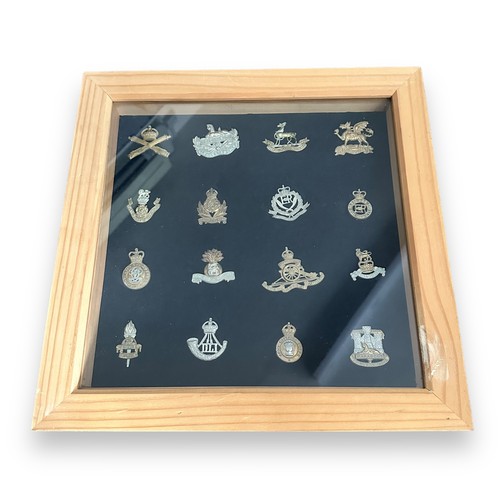 58A - Cap badges in two frames and loose, 31 badges in total with 27 in frames. Includes Royal Warwickshir... 