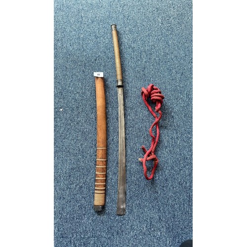 85 - Burmese DHA Sword with Scabbard. Well kept sword, with sharp blade. Scabbard with red rope. Pattern ... 