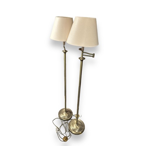 464 - Two 20th Century Metal Floor Lamps. Swing arm floor standing standard lamps. The lamps each raised o... 