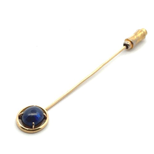 10 - A sapphire cabochon pin set in unmarked gold, mount tested using XRF as 15ct gold. Sapphire 8mm x mm... 