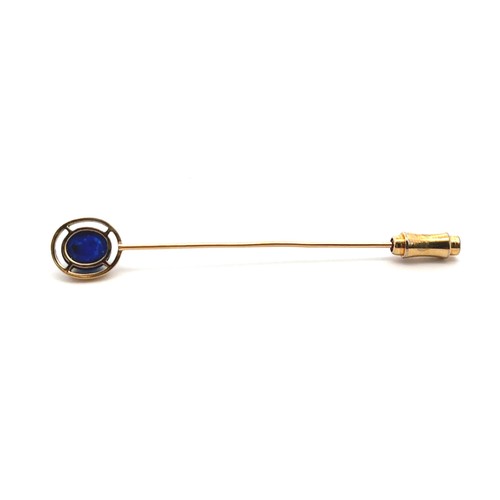 10 - A sapphire cabochon pin set in unmarked gold, mount tested using XRF as 15ct gold. Sapphire 8mm x mm... 