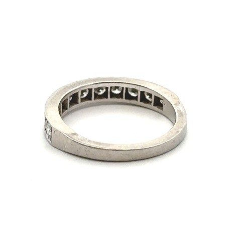 66 - An eleven stone diamond half eternity ring, size  M. Unmarked white metal tested as platinum using X... 