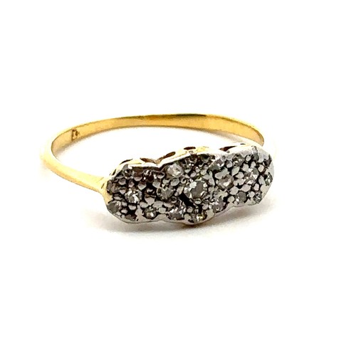 53 - A vintage diamond ring with small diamonds set in a white metal facing yellow gold mount, size M.  G... 