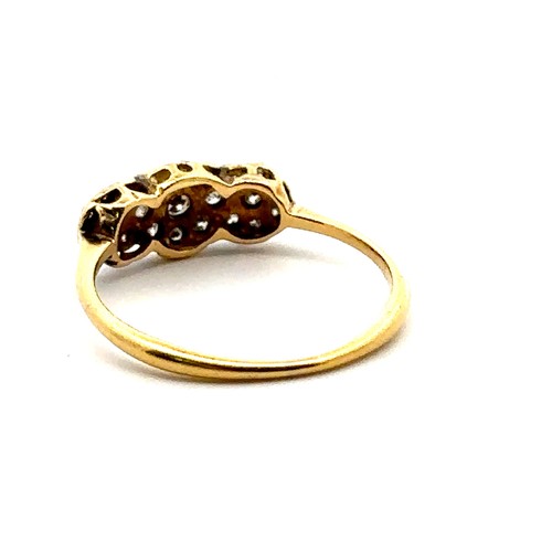 53 - A vintage diamond ring with small diamonds set in a white metal facing yellow gold mount, size M.  G... 