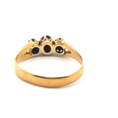 38 - A three stone garnet ring, size O. Hallmarks rubbed and unclear but tested as using XRF as 18ct gold... 