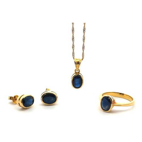 39 - A sapphire and 18ct gold necklace, earrings and ring set. Pendant set with sapphire 8mm x 6mm, stamp... 