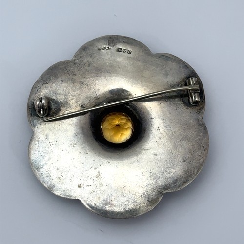 8 - A Scottish agate and citrine silver brooch. Citrine approx 11mm in diameter, brooch width 55mm. Hall... 