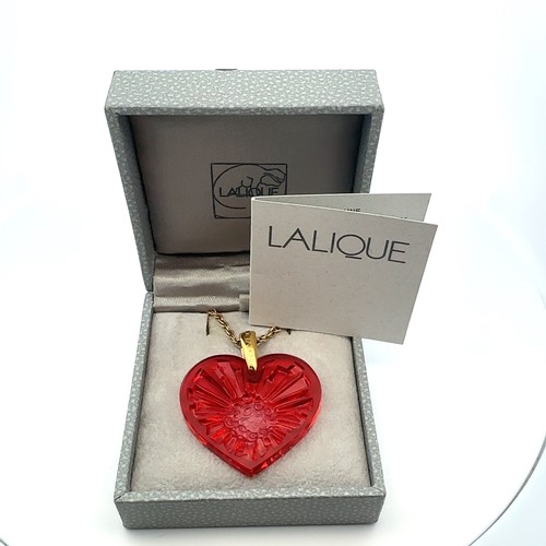 7 - A boxed Lalique red heart glass pendant on a 17