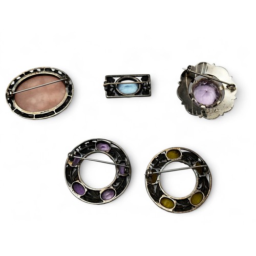 67 - Five gem set brooches. Four hallmarked or stamped silver  including two Scottish amethyst brooches, ... 