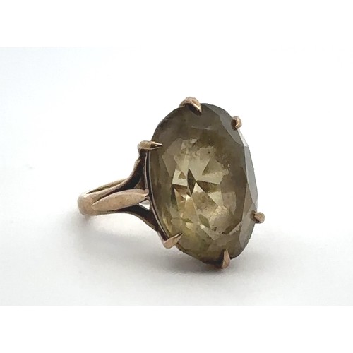 68 - A prasiolite quartz 9ct gold ring, size J.  Quartz approx 18 x 12mm with minor nibbles on facet edge... 