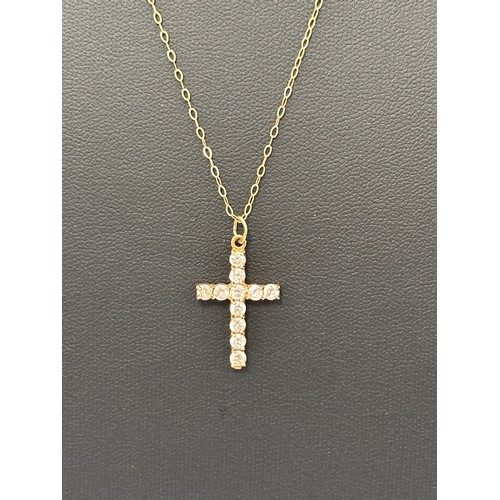 25 - A CZ and 9ct gold cross pendant necklace. Pendant hallmarked, 16