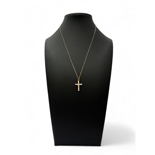 25 - A CZ and 9ct gold cross pendant necklace. Pendant hallmarked, 16