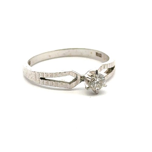 35 - An 18ct white gold single stone ring, size M. Estimated diamond weight 0.15ct. Weight 3.1g