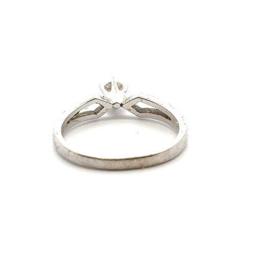 35 - An 18ct white gold single stone ring, size M. Estimated diamond weight 0.15ct. Weight 3.1g