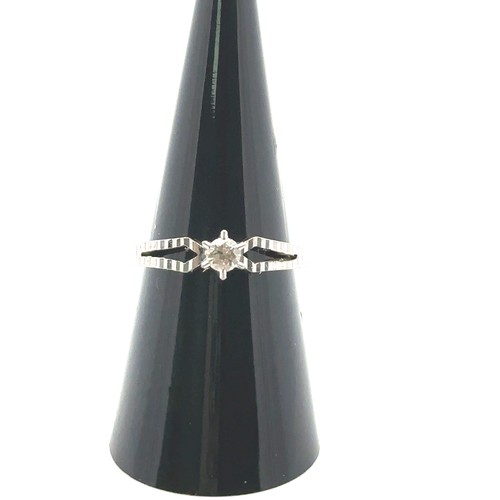 35 - An 18ct white gold single stone ring, size M. Estimated diamond weight 0.15ct. Weight 3.1g