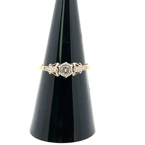 23 - An 18ct and plat diamond ring, size M. Estimated 0.15ct, weight 2.7g.