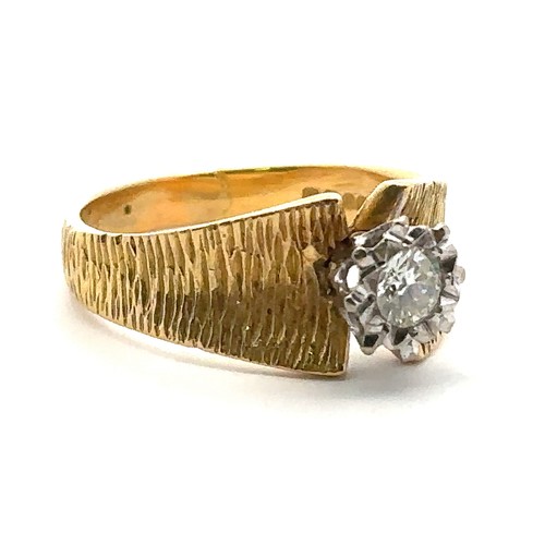 36 - An 18ct illusion set diamond ring with bark effect shank. Size P. Diamond approx 0.25ct. Weight 5.4g... 