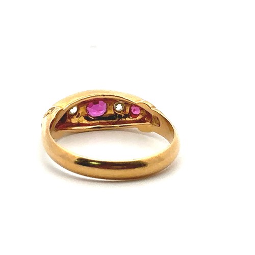 47 - An 18ct yellow gold ruby and diamond gypsy ring, size L/M. 1909 Chester hallmarks. Small chip to gir... 