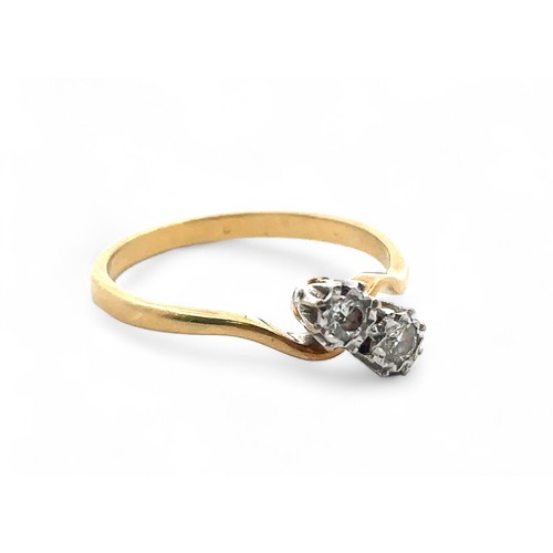 49 - 18ct gold and diamond crossover ring set with two diamonds, each around 0.07ct. Size S.  Hallmarks f... 