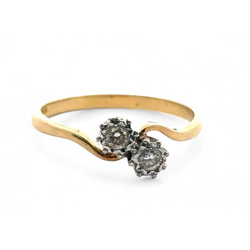 49 - 18ct gold and diamond crossover ring set with two diamonds, each around 0.07ct. Size S.  Hallmarks f... 