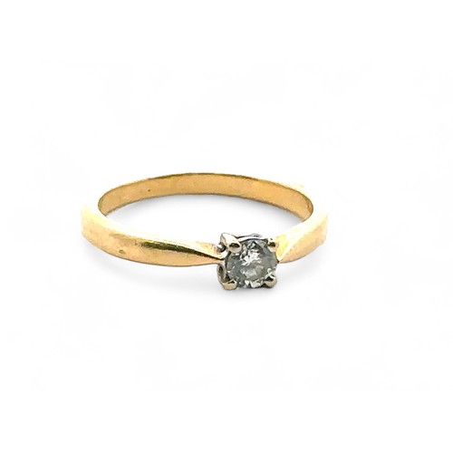 60 - A 0.2ct diamond solitaire ring set in hallmarked 18ct yellow gold, size J. Sponsor E.F. Weight 2.2g.