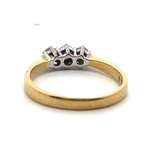 76 - A three stone diamond ring set in hallmarked 18ct yellow gold. Size L. estimated diamond weight 0.25... 