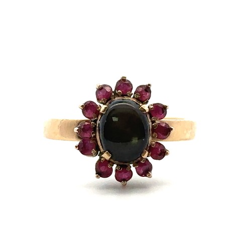 28 - A gold sheen obsidian and ruby cluster ring, size P. Weight 3.13g. Obsidian approx 8mm x 6mm. Stampe... 