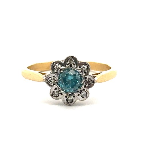 70 - A blue zircon and diamond flower ring stamped 18ct and Plat. Size O/P.  Condition. Overall good. Sma... 