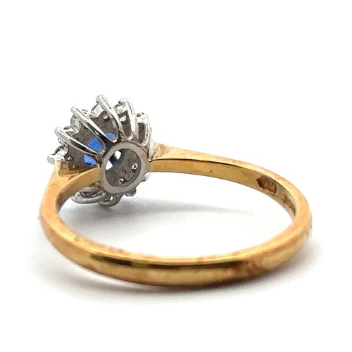 79 - An 18ct gold, sapphire and diamond cluster ring, size N. Sapphire approx 4mm in diameter -likely syn... 