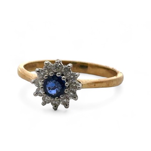 79 - An 18ct gold, sapphire and diamond cluster ring, size N. Sapphire approx 4mm in diameter -likely syn... 