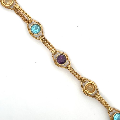 4 - A multi-gem bracelet gold bracelet stamped 512AR 750. The bracelet comprising of collet set amethyst... 