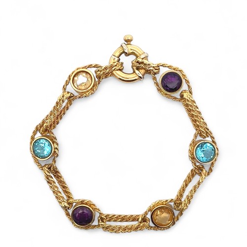 4 - A multi-gem bracelet gold bracelet stamped 512AR 750. The bracelet comprising of collet set amethyst... 