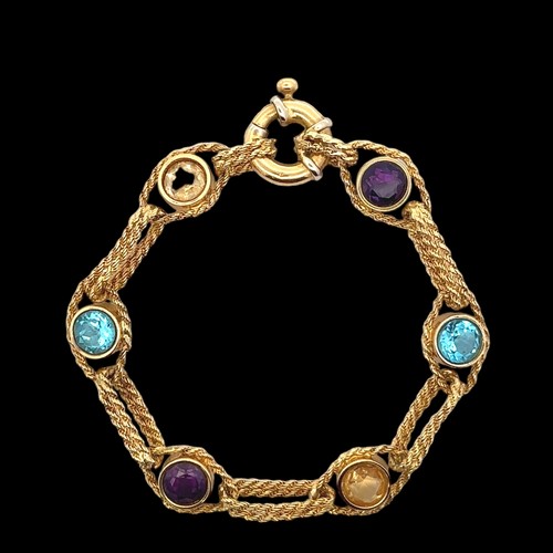 4 - A multi-gem bracelet gold bracelet stamped 512AR 750. The bracelet comprising of collet set amethyst... 