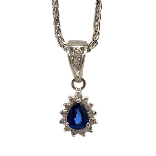 30 - A sapphire and diamond necklace and earrings set. The necklace with a central pear shaped sapphire s... 