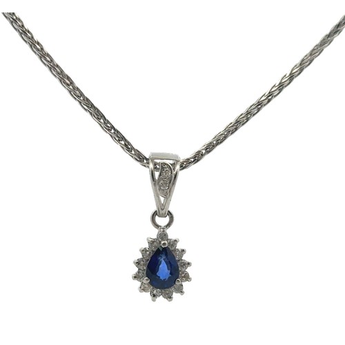 30 - A sapphire and diamond necklace and earrings set. The necklace with a central pear shaped sapphire s... 