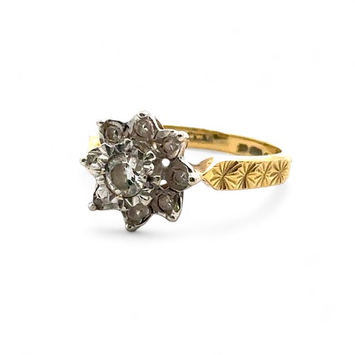 31 - An 18ct yellow gold and diamond flower ring, size I. Central diamond of approx 0.2ct is illusion set... 