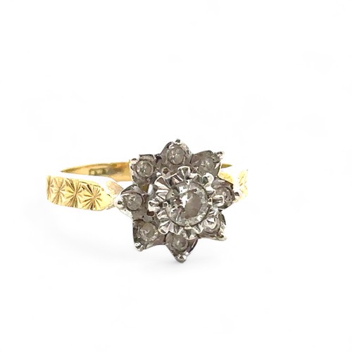 31 - An 18ct yellow gold and diamond flower ring, size I. Central diamond of approx 0.2ct is illusion set... 